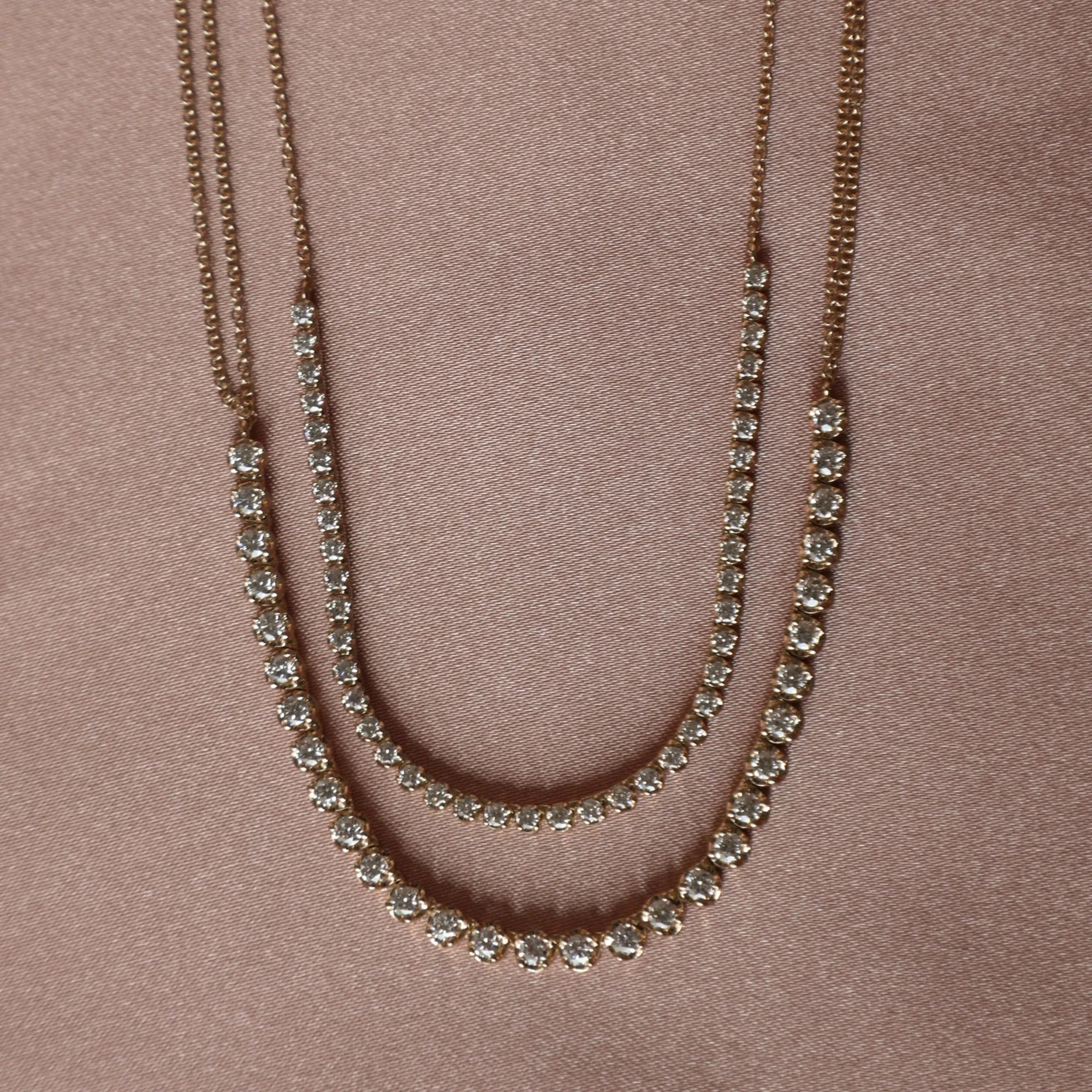 two tennis necklaces comparing sizes