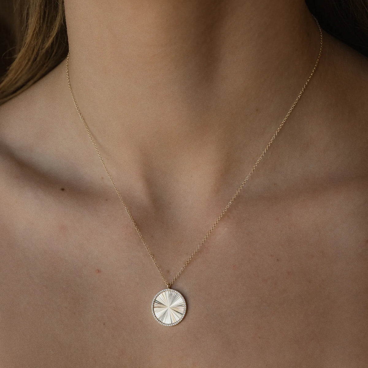 14k yellow gold diamond rimmed medallion necklace, layered necklace with sunburst pendant, Mama Bijoux Costa Mesa Orange County jewelry
