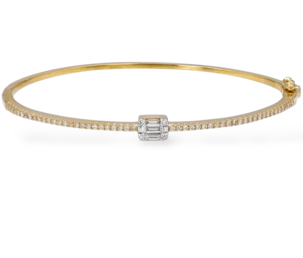 Bangle with a row of diamond baguettes in a sleek gold band. Mama Bijoux Fine Jewelry 14k Yellow Gold