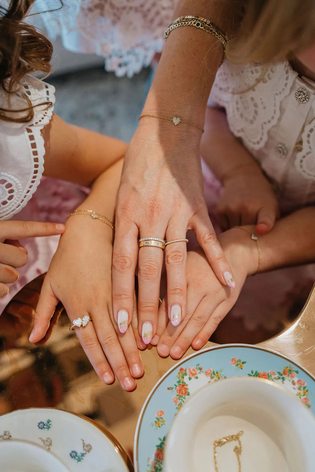 Mom & Babe Matching Diamond Heart Bracelet Set in 18k yellow gold: worn on wrist, mom and children's hands together