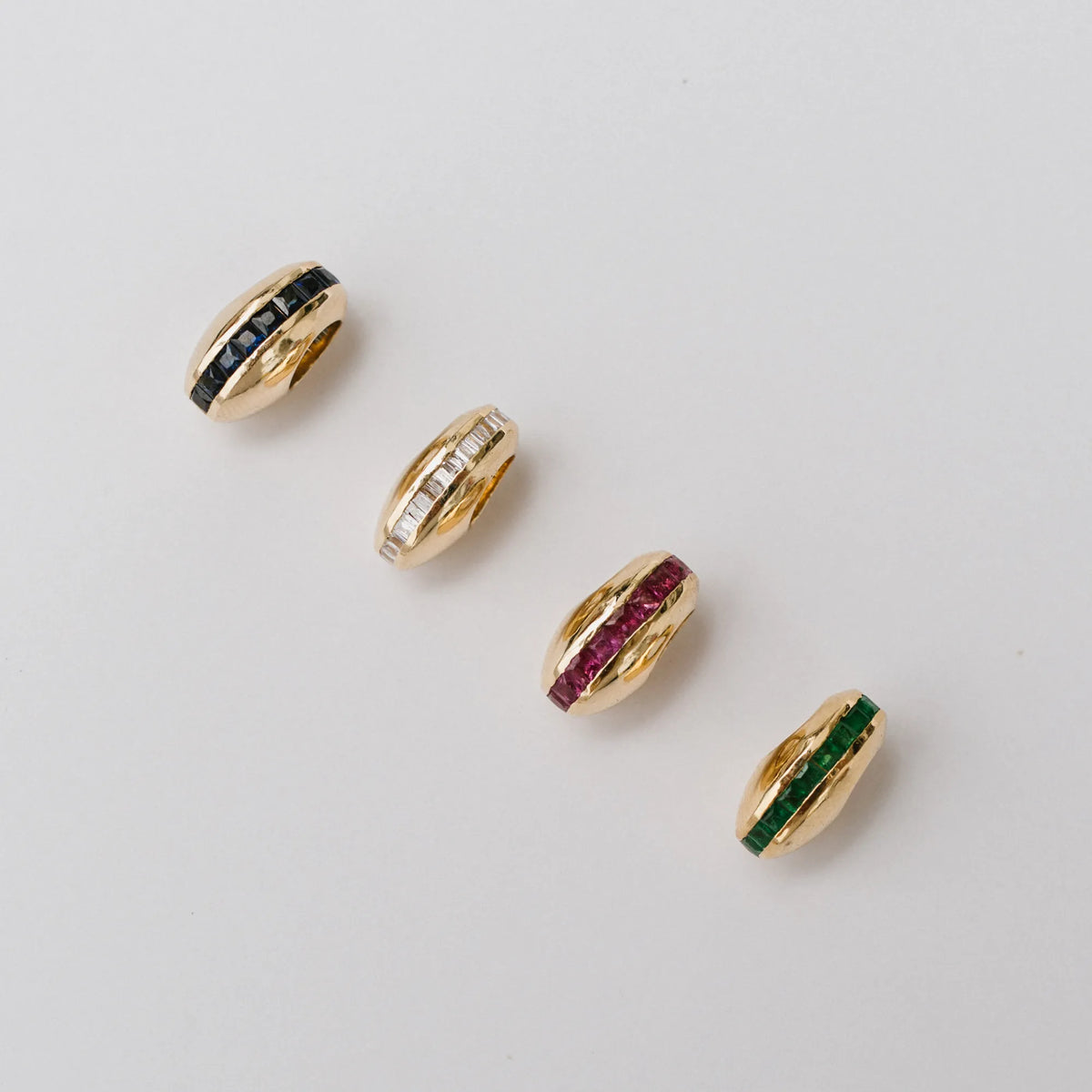 14k yellow gold puffy bead charms in diamond, emerald, sapphire, and ruby, channel set gemstone charm colorways by Mama Bijoux