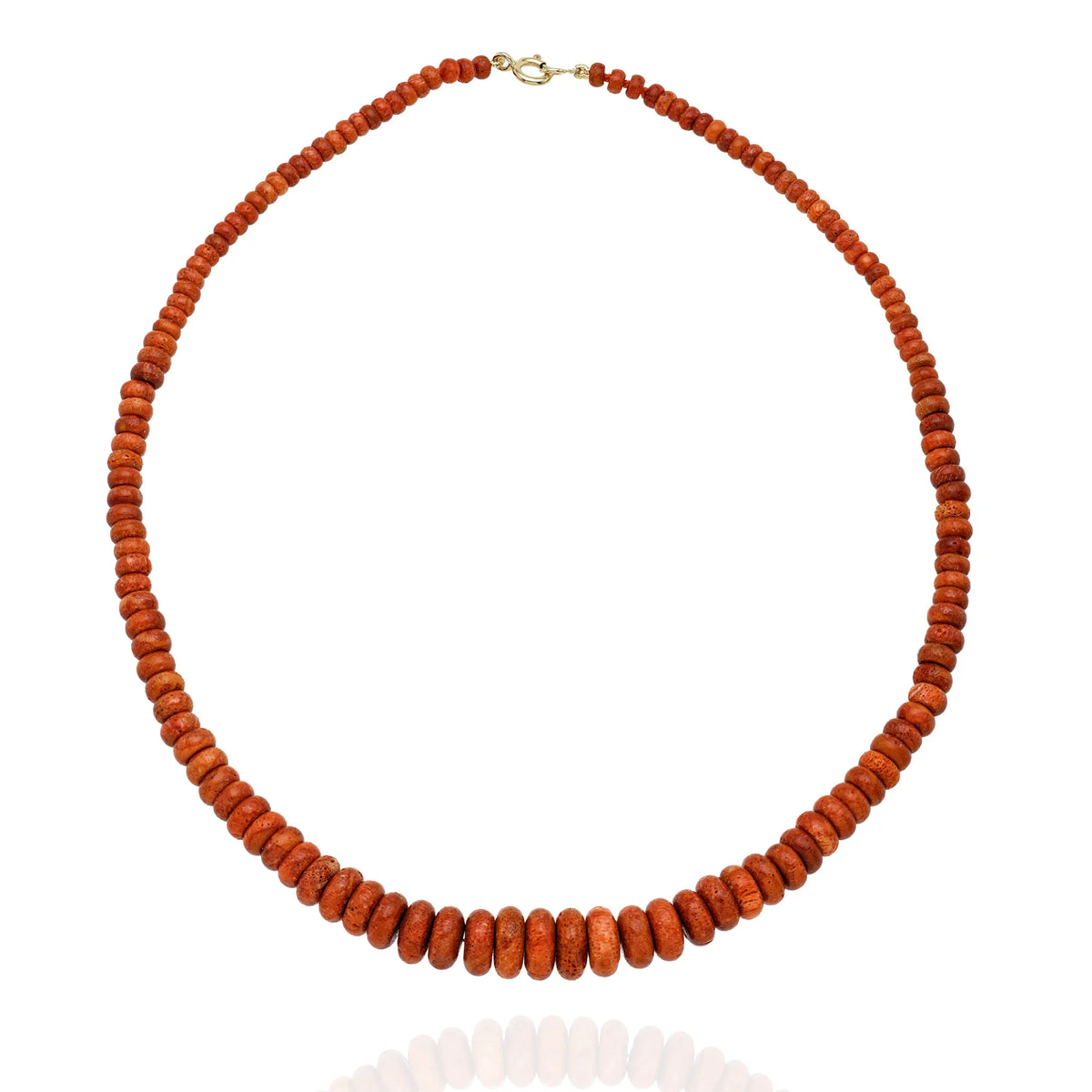 Natural coral graduated beaded necklace featuring warm coral beads in an elegant fine jewelry design