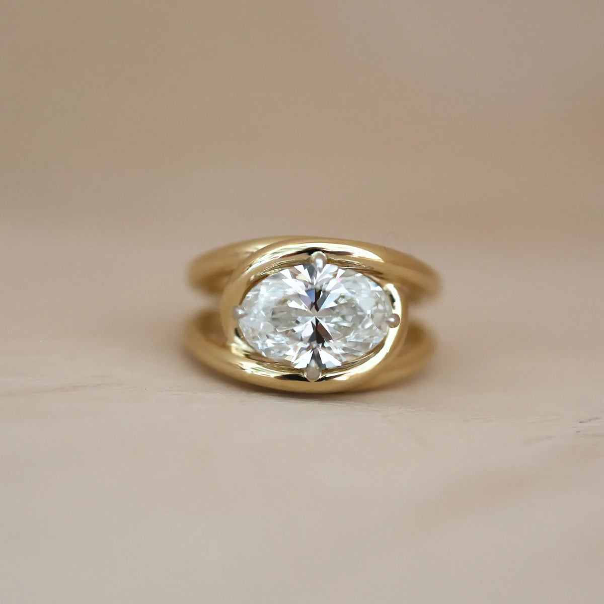 Yellow gold oval diamond engagement ring, an example of the 2026 engagement ring trend toward oval cuts and warm gold settings