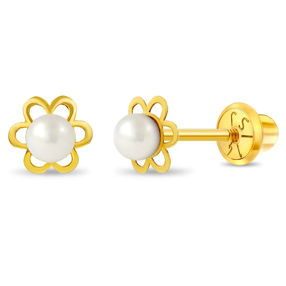 Gold earrings with pearl centers on a white background