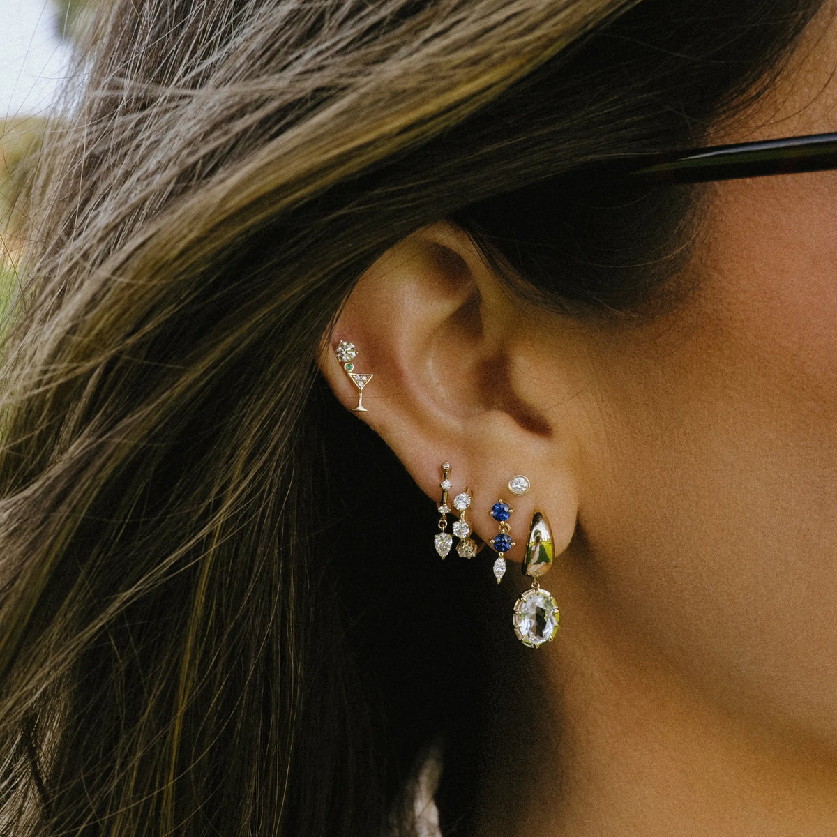 Lab diamond scattered huggie earrings in 14k yellow gold worn in ear stack, everyday earrings by Mama Bijoux Orange County