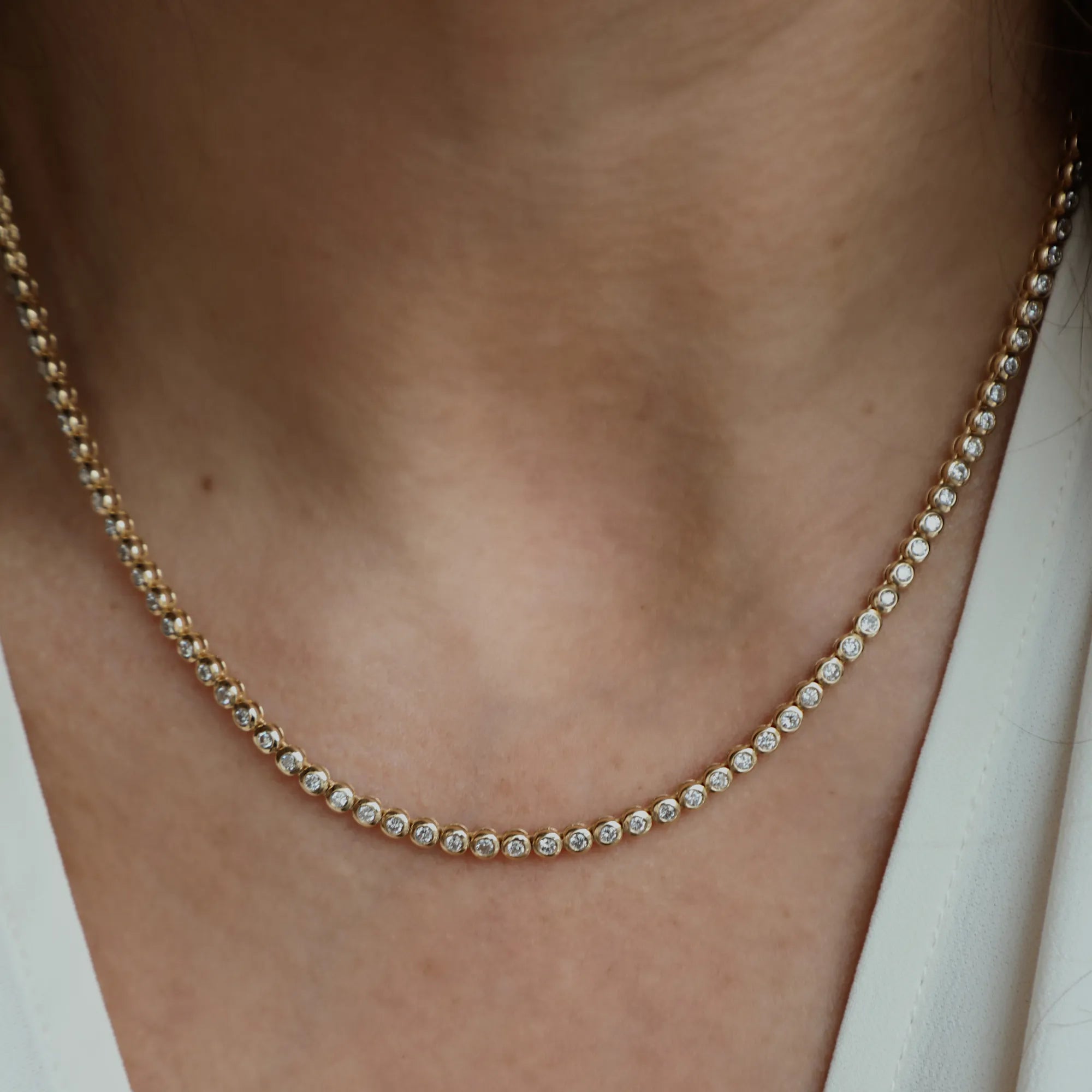 bezel tennis necklace on neck
