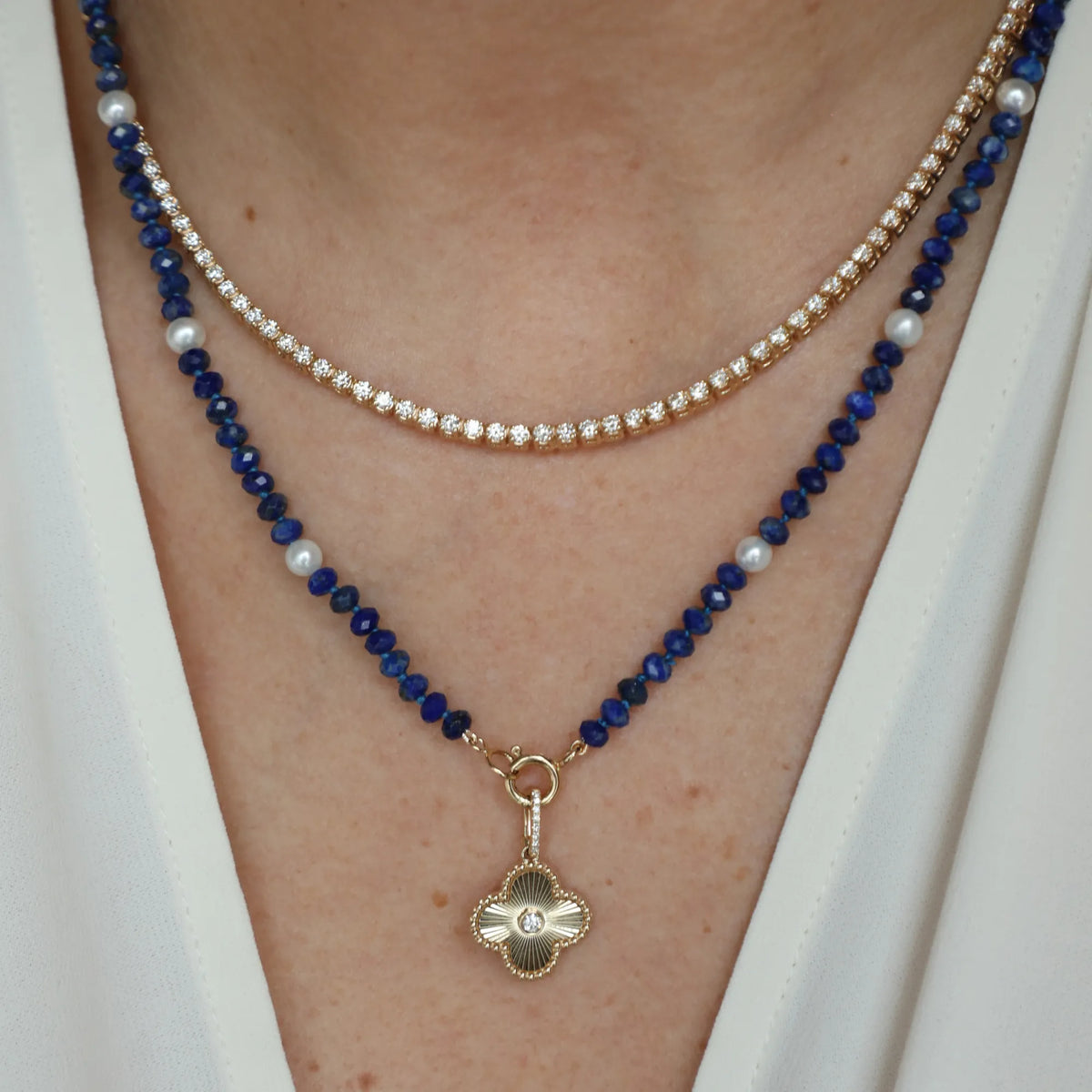 Natural lapis and pearl beaded necklace with gold charm pendant, layered necklace styling by Mama Bijoux Orange County fine jewelry