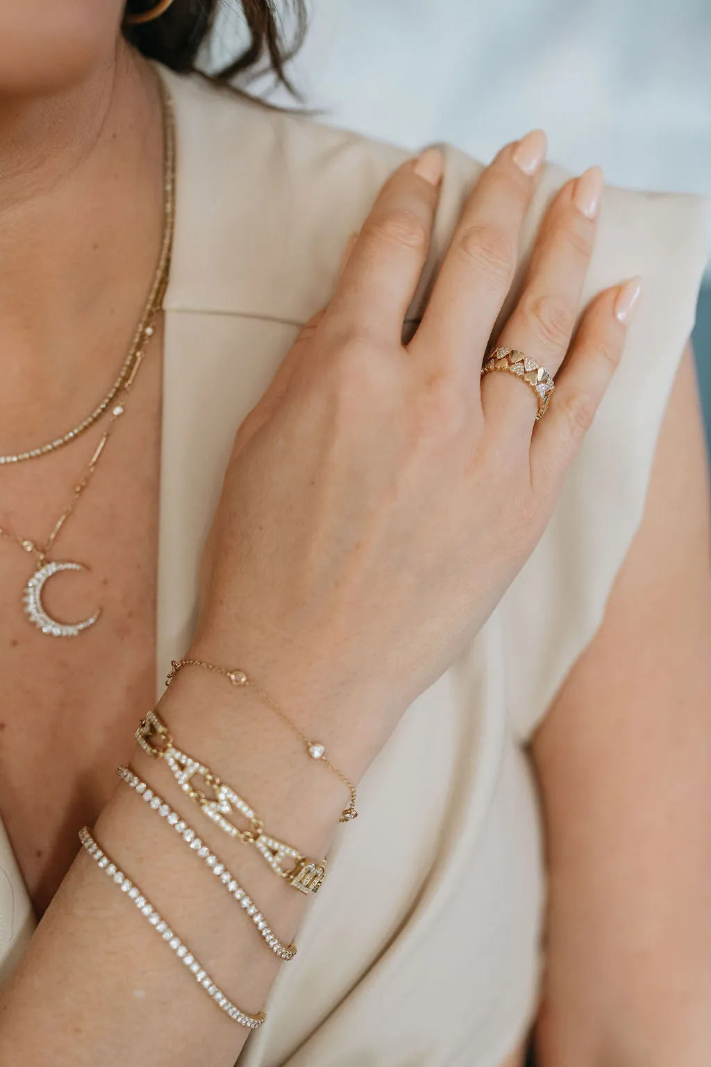Mama Bijoux diamond tennis bracelet layered with fine gold bracelets