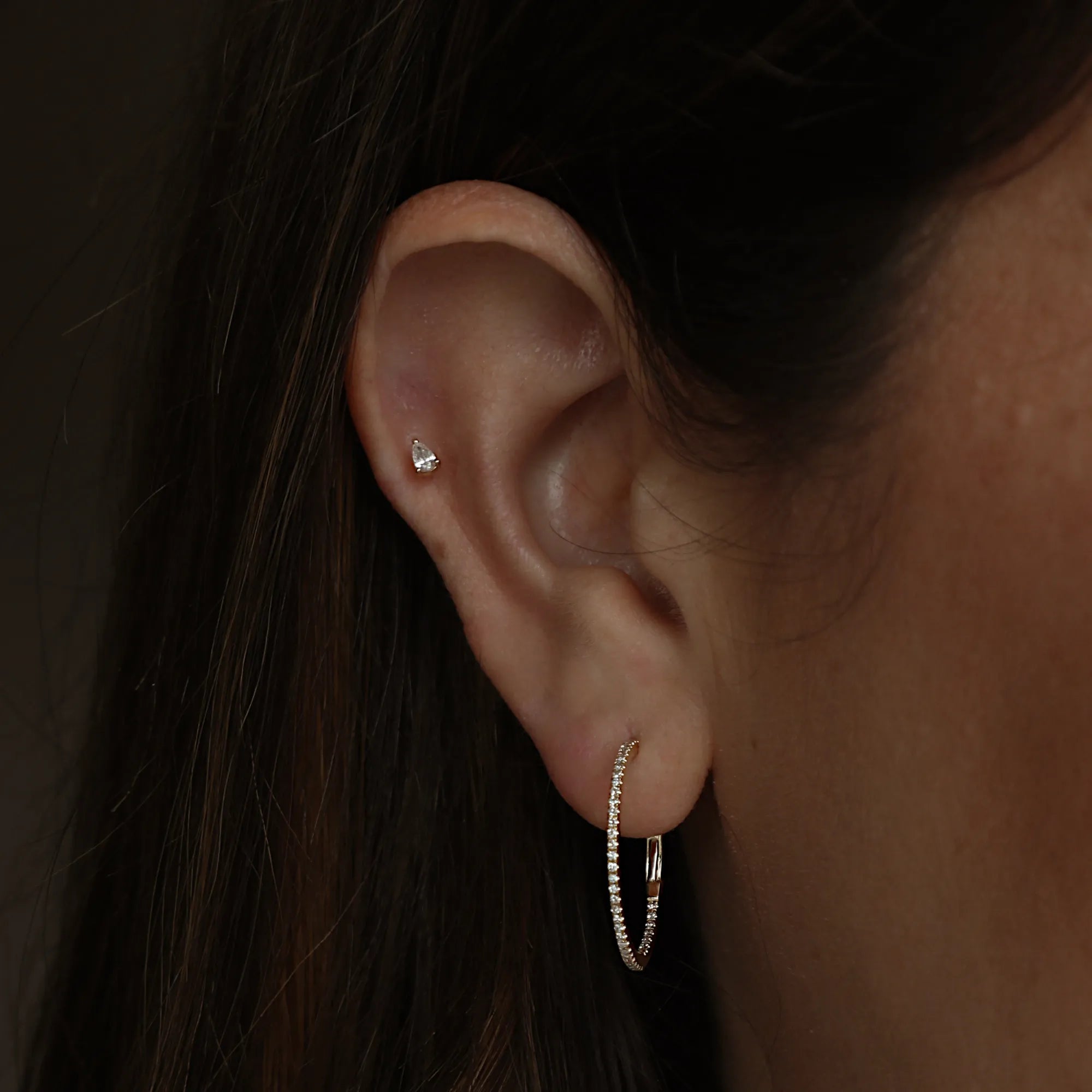 diamond hoops on an ear