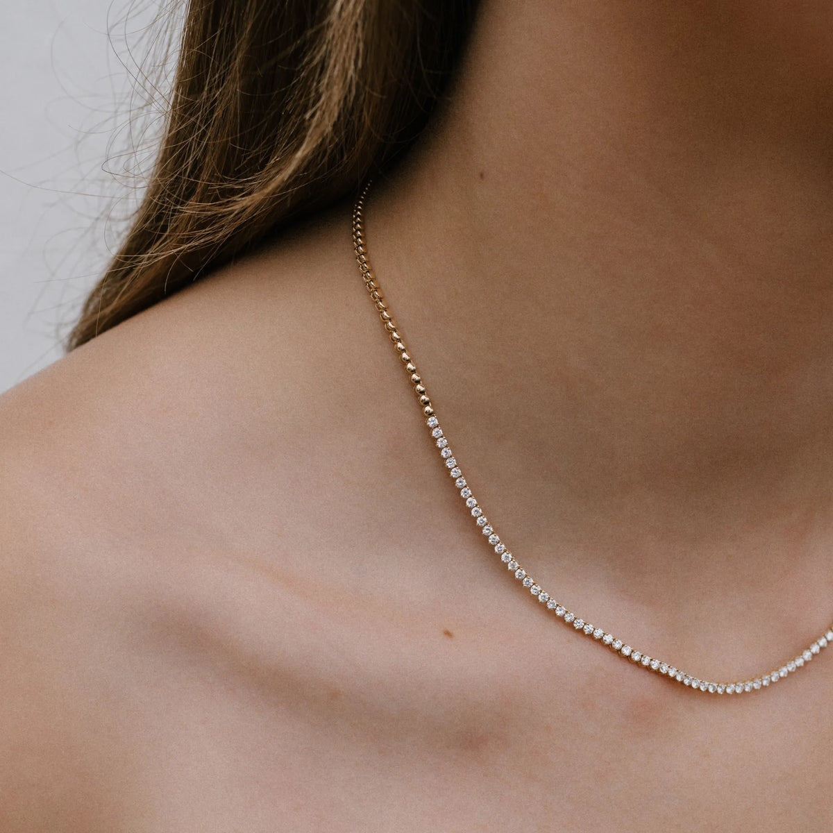 Diamond tennis necklace styled on neck, 14k yellow gold three prong setting, Mama Bijoux Costa Mesa Orange County jewelry