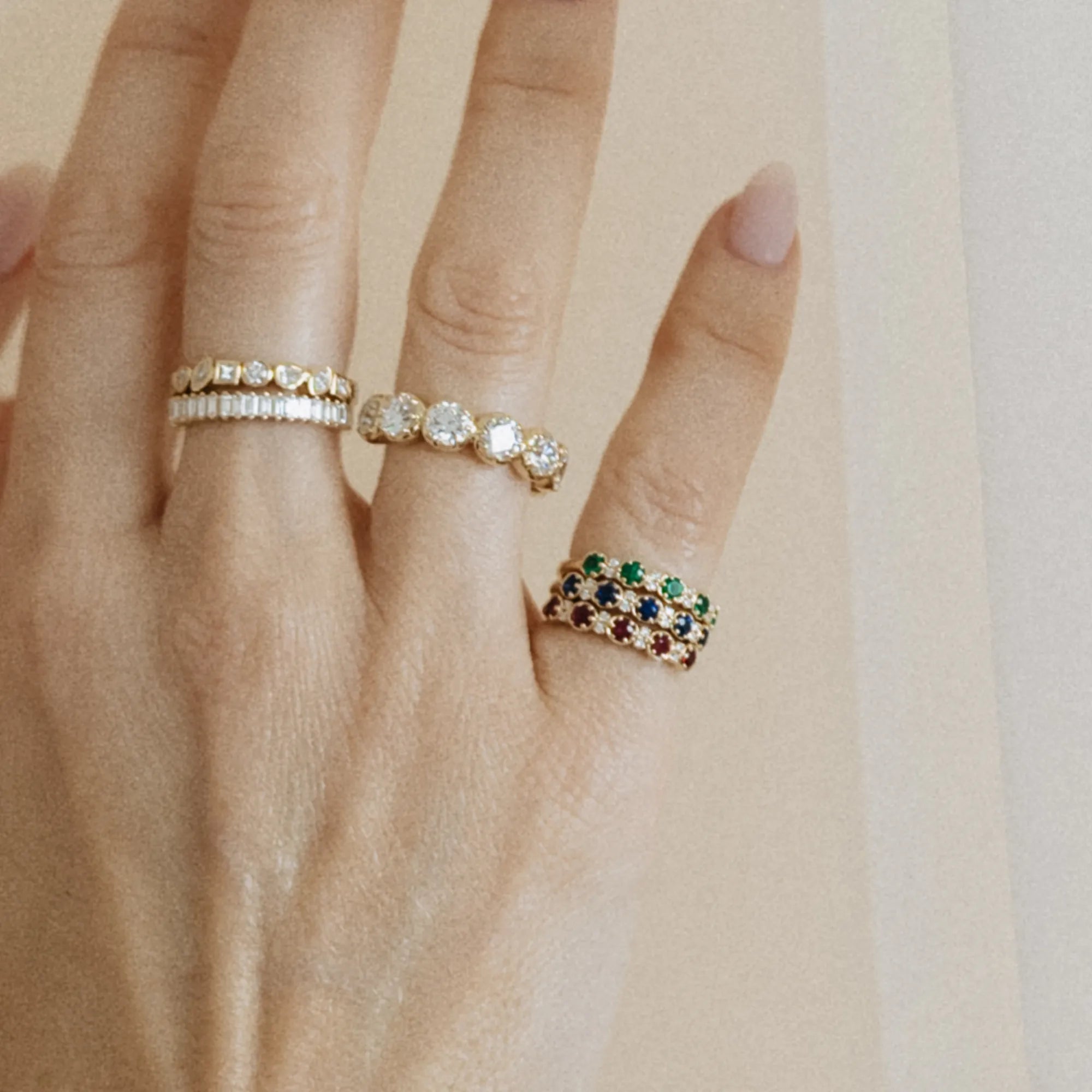 Curated birthstone and diamond stacking pinky ring stack with ruby sapphire emerald and diamond rings in 14k yellow gold Mama Bijoux Costa Mesa