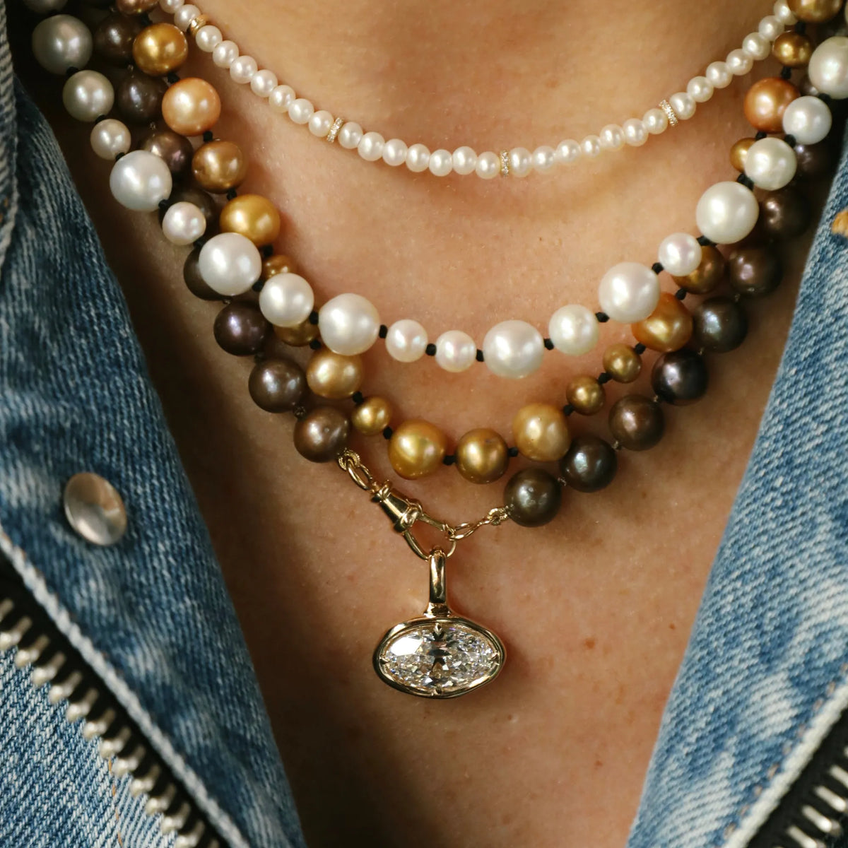 Diamond pendant layered with multicolor pearl necklaces, gold bezel diamond pendant, pearl necklace stack, Costa Mesa fine jewelry