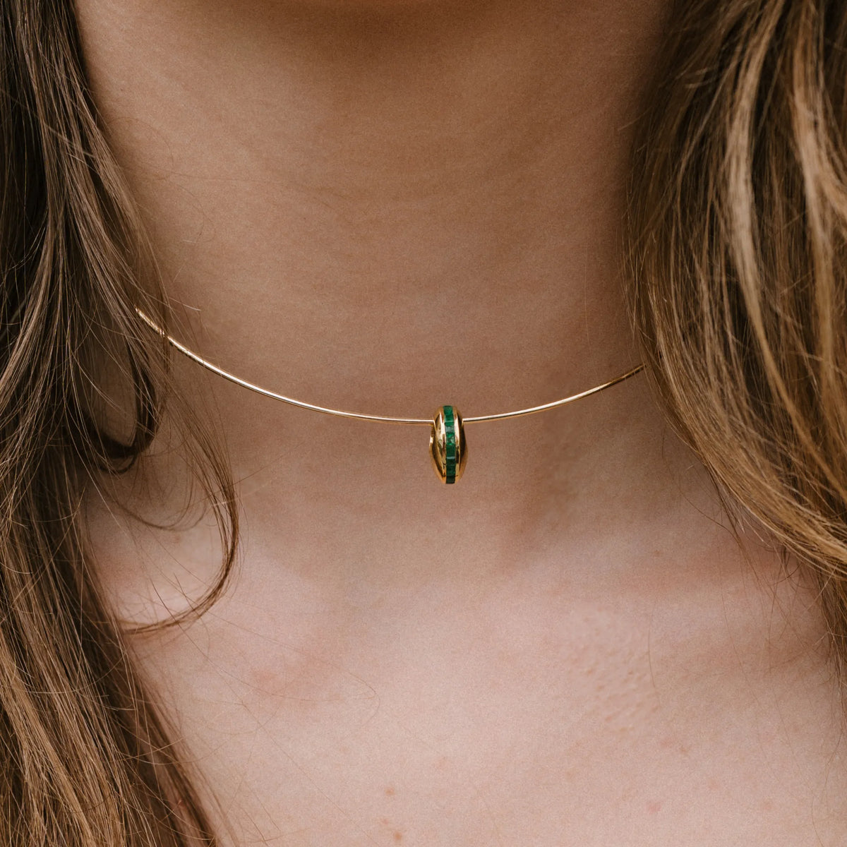 14k yellow gold necklace with channel set emerald puffy bead charm worn close up, dainty necklace by Mama Bijoux Costa Mesa