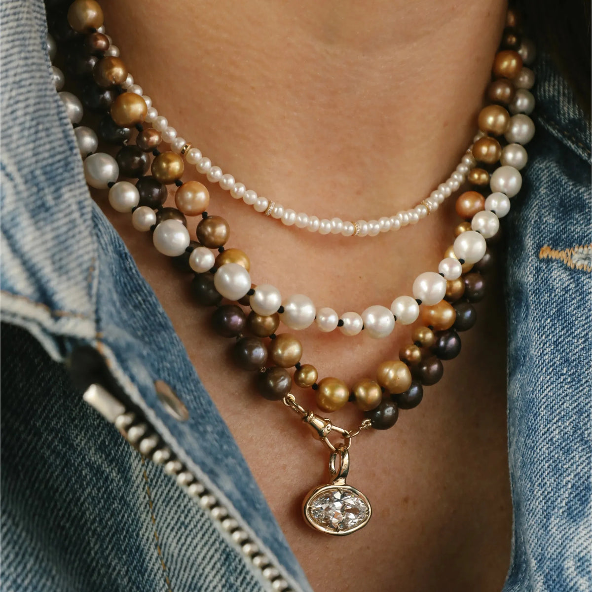 Layered freshwater pearl necklaces multicolor and white pearl necklace stack with 14k gold oval diamond bezel pendant worn on neck Mama Bijoux Costa Mesa fine jewelry