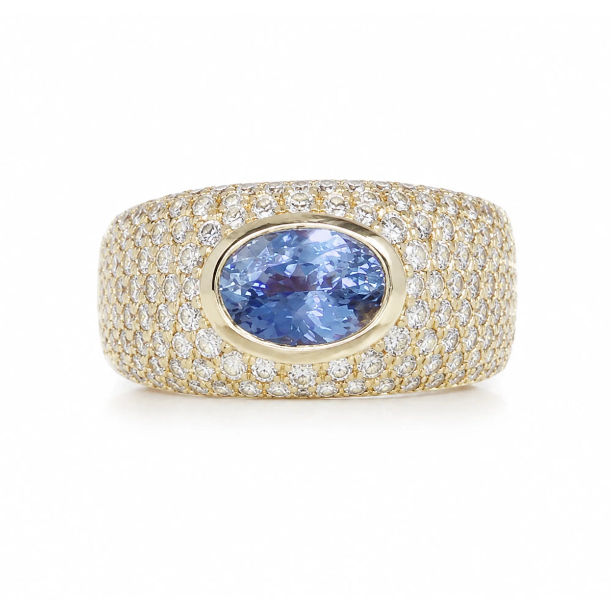 Light blue sapphire pinky ring with oval sapphire center and full pavé diamond cigar band in luxury fine jewelry