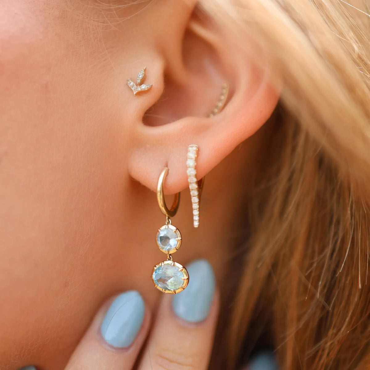 Blue topaz Georgian drop statement earrings worn as part of curated ear stack with diamond huggie hoops and ear cuff, ear curation fine jewelry Mama Bijoux