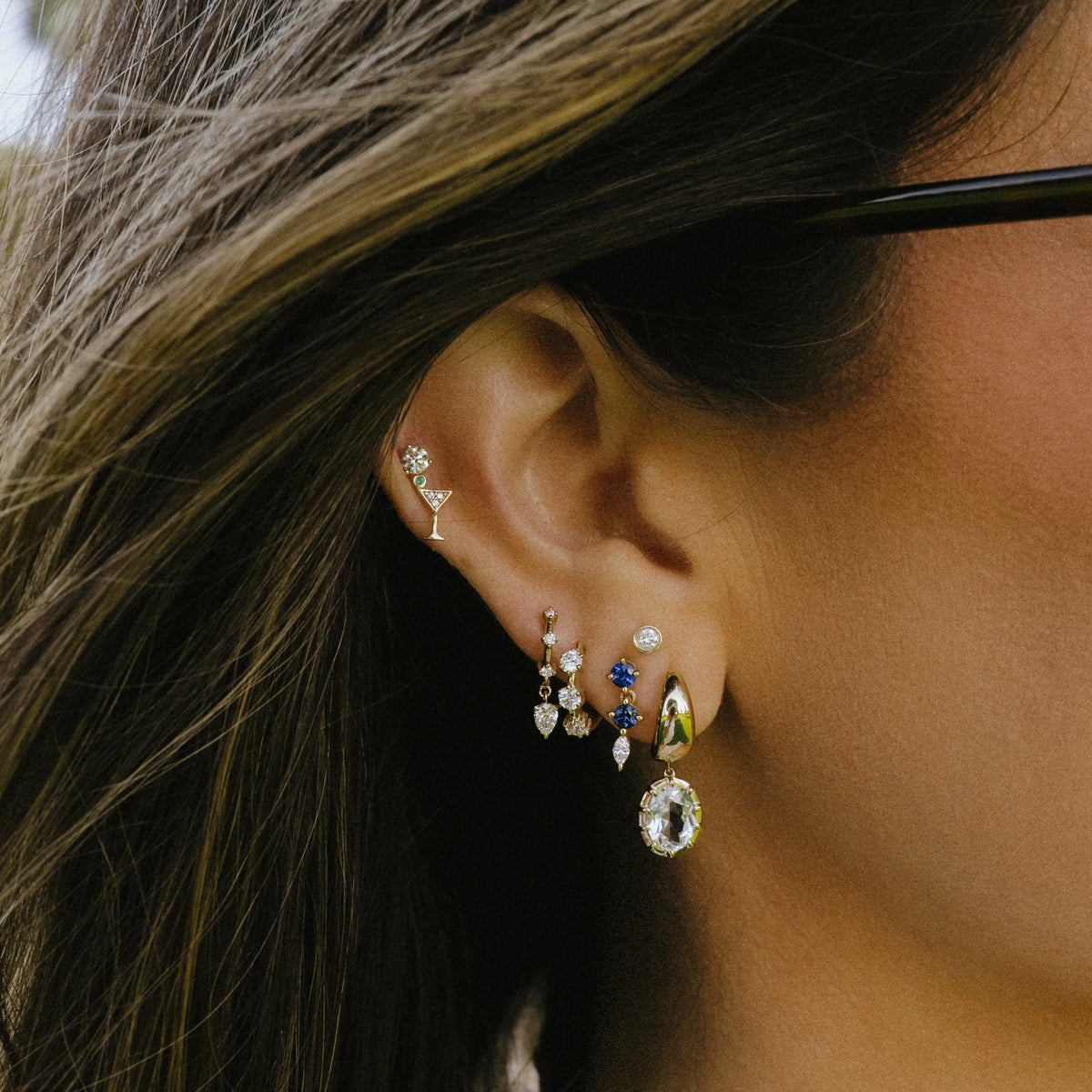 Martini glass stud earrings worn in ear stack with hoops and huggies, gold stud earrings by Mama Bijoux Orange County