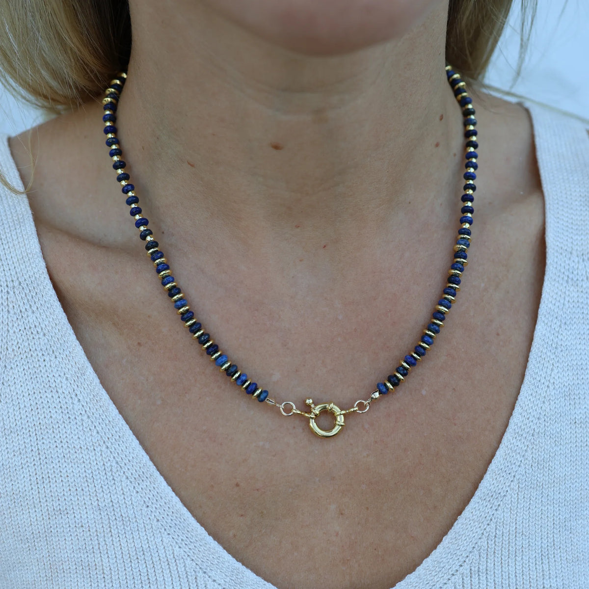 Model wearing the Twilight lapis lazuli beaded necklace by Mama Bijoux x Isla Sol featuring natural blue gemstones and 18k gold accent beads.