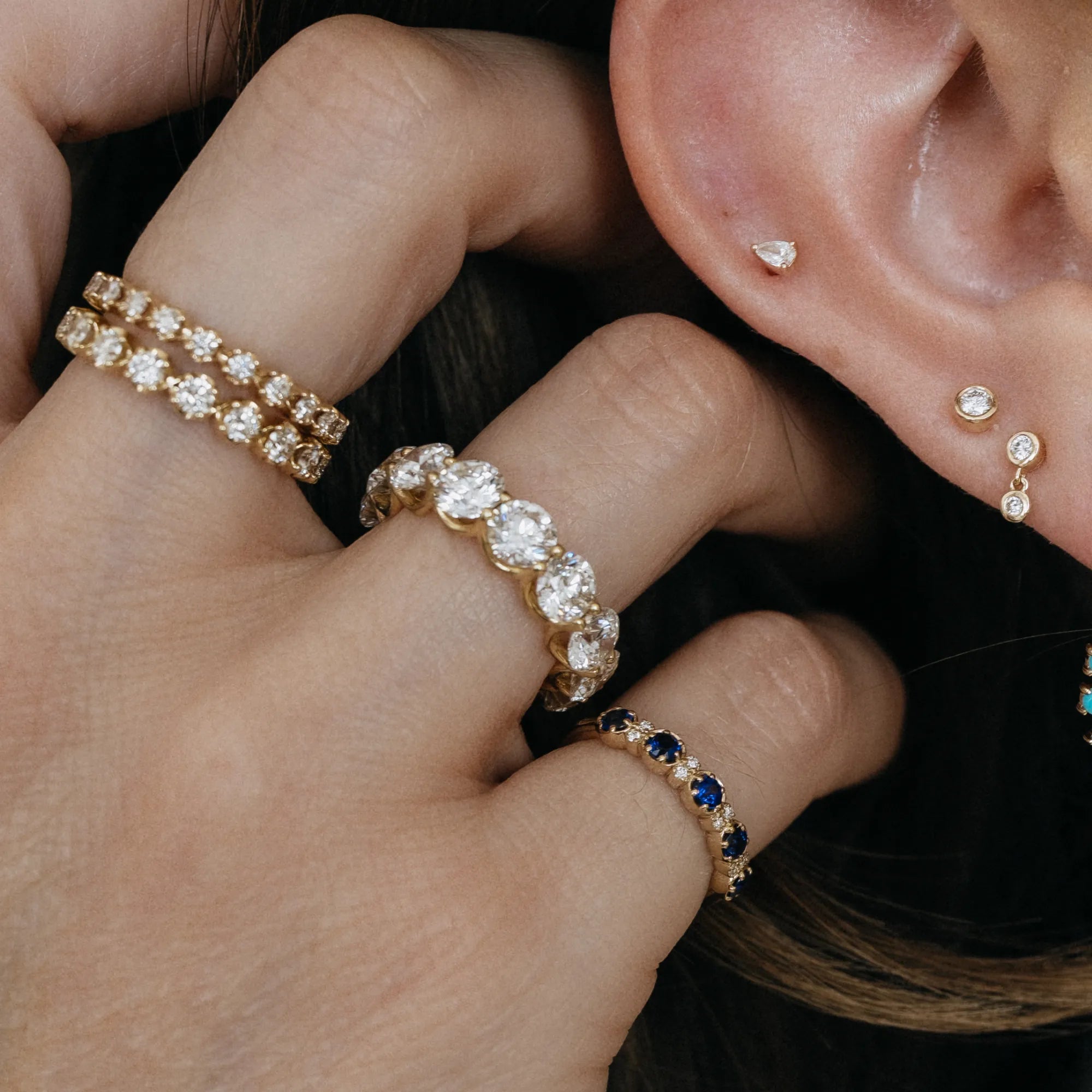 U set shared prong lab diamond eternity band in curated ring stack with Georgian diamond band sapphire eternity band and diamond drop earrings 14k yellow gold Mama Bijoux Costa Mesa